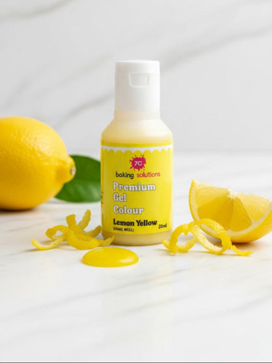 Bottle of lemon yellow colorant with lemons on a light background